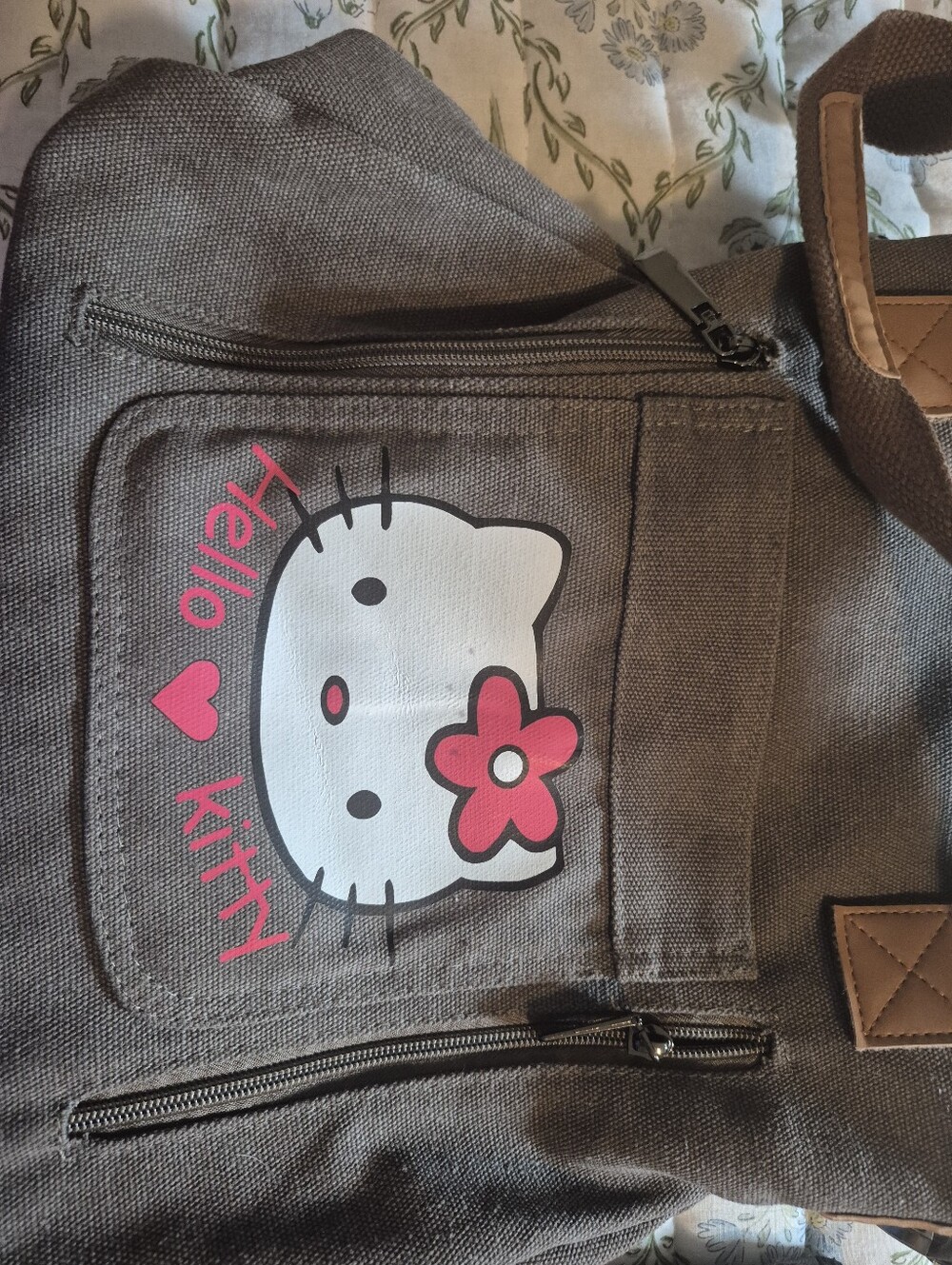 Hello Kitty Brown Hand Bag with Pink Accentsand A Large Coin Mickry Bag.